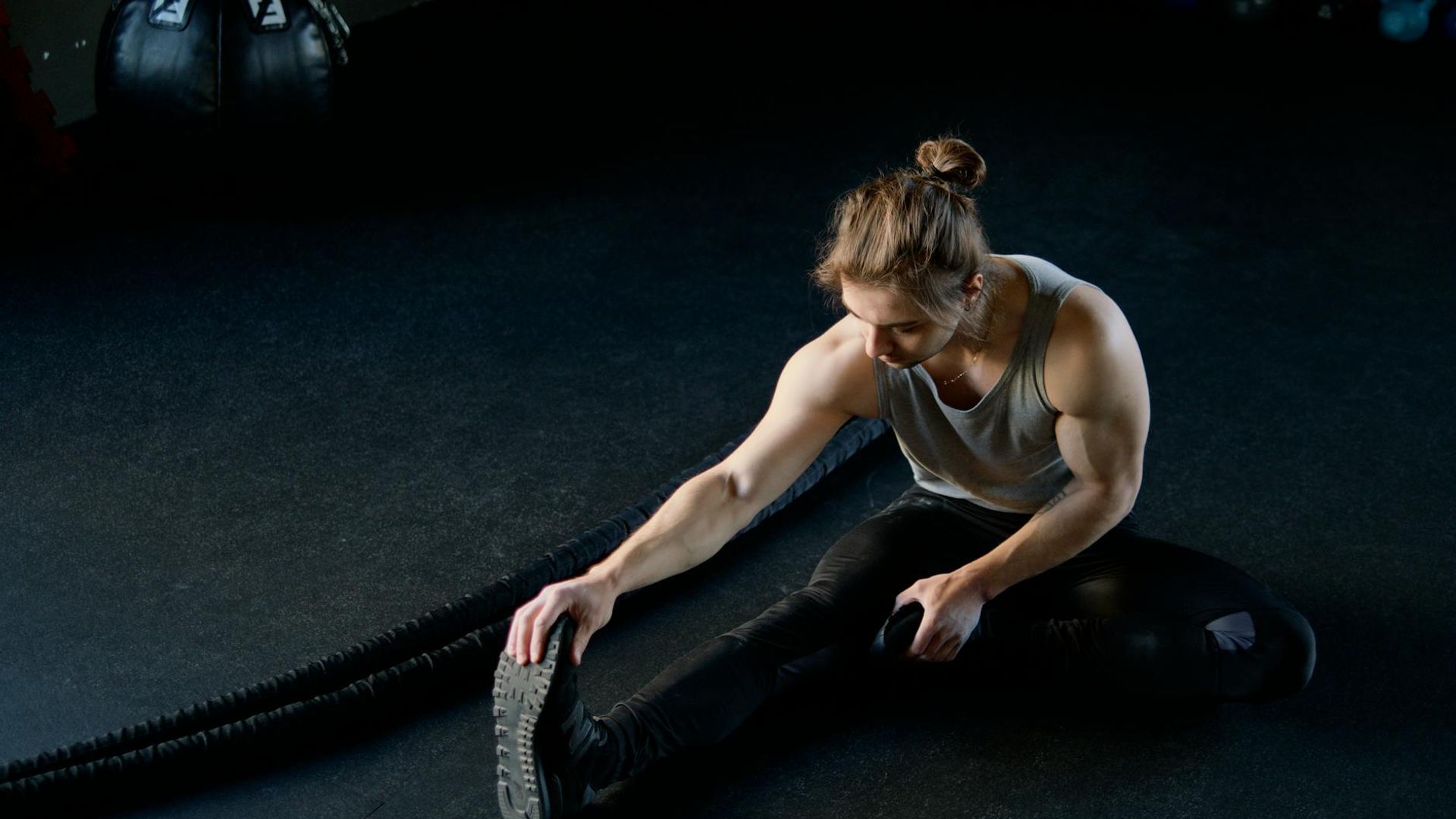 Man focused on training in a modern minimalist gym environment